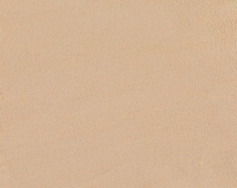 以下が含まれることがあります： テクスチャ加工された明るいタン色の表面のクローズアップ。表面はわずかに粗く、スエードのような外観で、色とテクスチャに微妙なバリエーションがあります。全体的なトーンは暖かく、ニュートラルです。