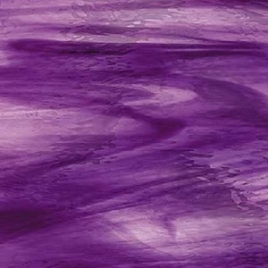 May include: Purple iridescent glass with a swirling pattern. The glass has a translucent quality with a light purple hue.