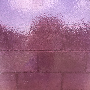 May include: Abstract image with a textured, frosted glass effect. The color gradient transitions from a light lavender at the top to a deep burgundy at the bottom, with horizontal lines subtly visible. The overall effect is soft and diffused.