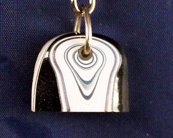 Fordite Keychain - 25.24mm x 21.56mm x 6.8mm       (2217)