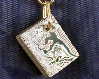 Fordite Keychain - 24.8mm x 19.4mm x 7.74mm          (2877)
