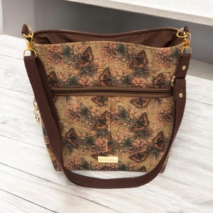 Large Cork Butterfly Crossbody Bag, Removable Adjustable Strap, Outside Zipper Pockets on Both Sides, 6 Inside Slip Pockets, Snap Closure