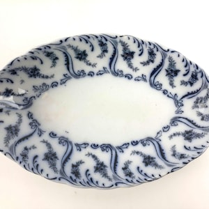 May include: A set of three ceramic mugs with a speckled, matte finish. The mugs are in shades of cream, light gray, and dark gray. Each mug has a simple, minimalist design, perfect for coffee or tea.