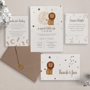 May include: A set of baby shower invitations with a celestial theme. The invitations feature a lion with a constellation design, stars, and the text "a sweet little Leo is on the way".