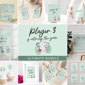 May include: A green and white printable baby shower invitation bundle with a gamer theme. The bundle includes a welcome sign, a guest book sign, a mom-osa bar sign, a calendar, cupcake toppers, tags, and cards. The design features a green and white game controller with flowers.