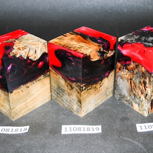 May include: Three wooden blocks with red and black resin. The blocks are labelled 11081818, 11081819, and 11081820.