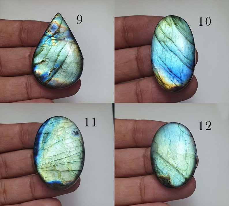 May include: Four labradorite gemstone cabochons in various shapes and sizes. The cabochons are a mix of green, blue, and gold colors with iridescent flashes. The cabochons are labeled with numbers 9, 10, 11, and 12.