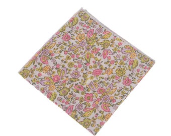 May include: A white fabric handkerchief with a floral pattern in shades of pink, yellow, and green.