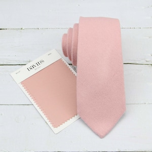 May include: A pink tie with a fabric swatch labeled "David's Bridal" in the "Ballet" color.