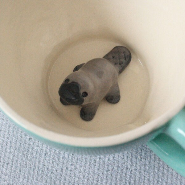 Surprise mug turquoise ceramic tea cup with platypus - tiled grey animal figurine miniature surprise cup