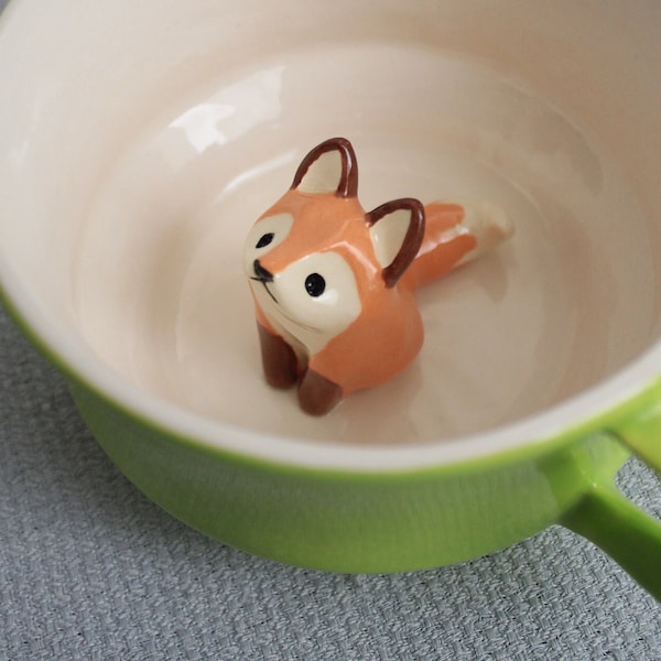 Surprise mug ceramic lime green coffee cup with lying red fox - tiled orange animal figurine miniature