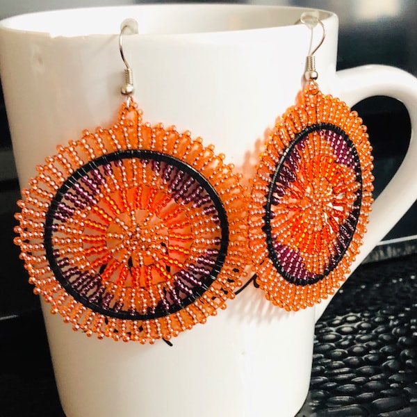 Zulu beaded earrings+ orange colored beads with a beautiful pattern in the middle +colorful  beads +unique style +can be with anything