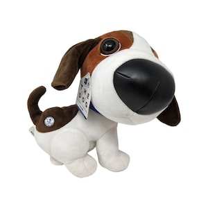 May include: Brown and white plush dog toy with large black nose and big eyes. The dog is wearing a blue collar with a tag that says "The Dog".