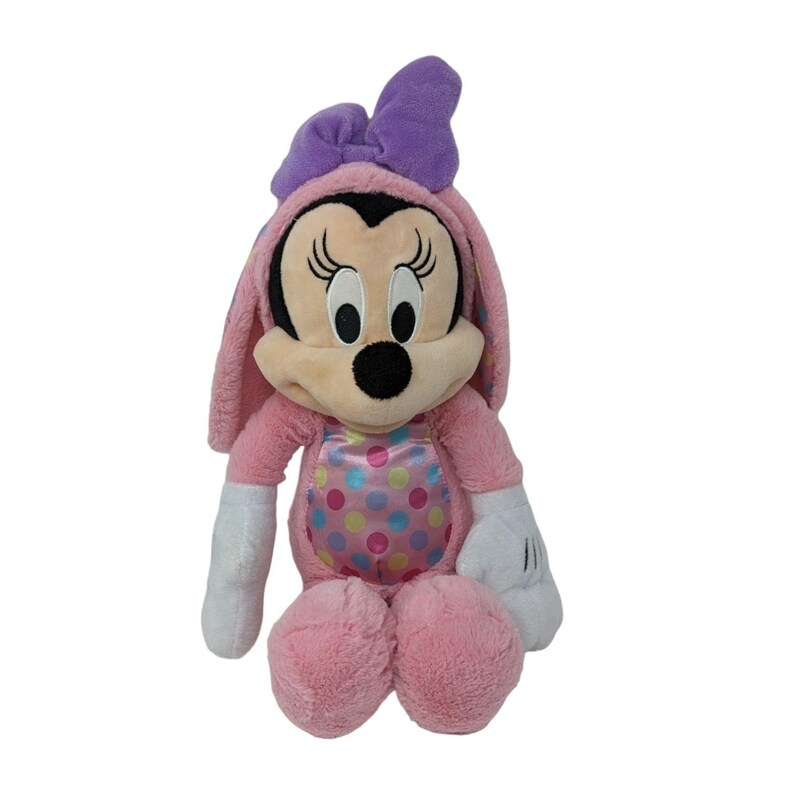 May include: Pink plush Minnie Mouse dressed as an Easter bunny with a purple bow. She has a pink and white polka dot dress and white gloves.