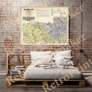 May include: A vintage map of the town of Haverstraw, New York, printed in black and white with yellow and blue accents. The map shows the town's streets, buildings, and parks. The map is framed and hanging on a brick wall.