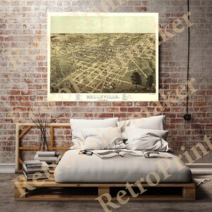 May include: An antique map print of Belleville, featuring a detailed aerial view of the city's layout. The map is in sepia tones, showcasing streets, buildings, and surrounding landscape. The title "Belleville" is prominently displayed at the bottom.