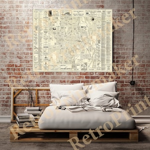 Può includere: Una mappa vintage di Calgary, Alberta, Canada, stampata in bianco e nero su uno sfondo crema. La mappa mostra le strade, i parchi e altri punti di riferimento della città. La mappa è circondata da pubblicità di aziende locali.