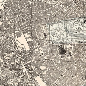 May include: A black and white map of London, England, showing the city's streets and landmarks. The map includes Hyde Park, Kensington Gardens, Buckingham Palace, and the Houses of Parliament.