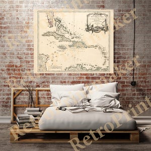 May include: An antique map of the Caribbean Islands, titled "Isle de la Mer du Nord, ou des Antilles, et des Isles Espagnoles, et de la Terre Ferme", printed on aged paper with a decorative border.
