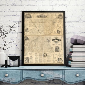 Puede incluir: Un mapa vintage enmarcado del condado de Winnebago, Illinois, colgado en una pared de ladrillo blanco sobre una cómoda azul con herrajes de metal negro. El mapa está en blanco y negro y muestra las calles y los edificios de la ciudad. Hay libros apilados en la cómoda junto al mapa.