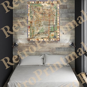 May include: A vintage map of a city with a detailed layout of streets and buildings. The map is framed and hanging on a wood-paneled wall above a bed with white bedding.