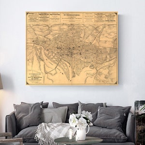 Puede incluir: Un mapa antiguo de la ciudad de Washington, D.C. impreso en blanco y negro sobre un fondo crema. El mapa muestra las calles, edificios y vías fluviales de la ciudad. El mapa está titulado "B.H. Warner & Co.'s Map of the City of Washington, D.C. and Suburbs."