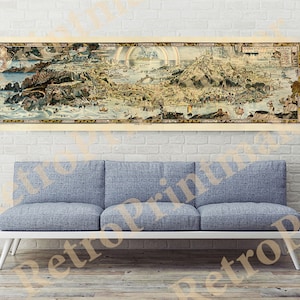 May include: A vintage map of a city with a rainbow over the center. The map is printed on a cream-colored background with brown and gold accents. The map is framed and hanging on a white brick wall above a gray couch.