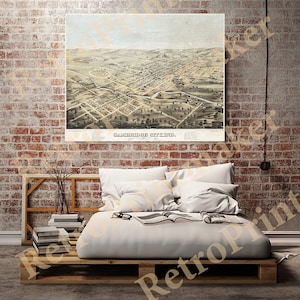 May include: An antique bird's-eye view map of Cambridge City, Indiana, printed in black and white with a light blue background. The map shows the city's streets, buildings, and surrounding landscape. The title "Cambridge City, Ind." is printed at the bottom of the map.