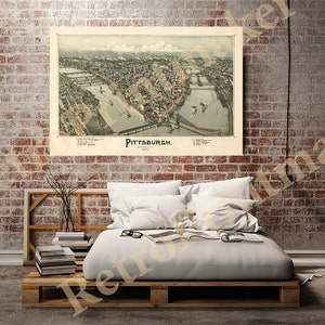 May include: An antique map of Pittsburgh, Pennsylvania, from 1882. The map shows the city's streets, rivers, and buildings in detail. The map is printed in black and white with some color accents.