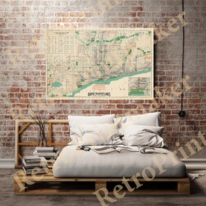 May include: A vintage map of the Rapid Transit Lines in the city of Cleveland, Ohio. The map is printed on a cream-colored paper with green and black lines representing the transit lines. The map is framed and hanging on a brick wall.