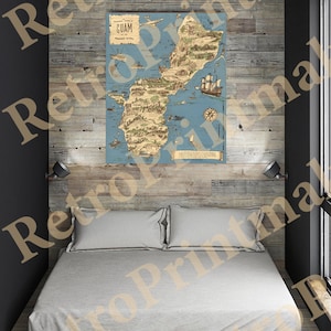 May include: A vintage map of Guam, a U.S. territory in the Pacific Ocean. The map is printed on blue paper and features a detailed illustration of the island's geography, including its coastline, mountains, and rivers. The map also includes a compass rose and a scale bar.