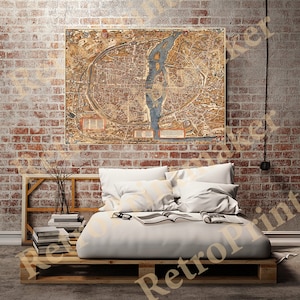 Peut inclure: Une carte ancienne de Paris, France, imprimée en encre brune, bleue et jaune sur un fond crème. La carte montre les rues, les bâtiments et les monuments de la ville, y compris la Seine.