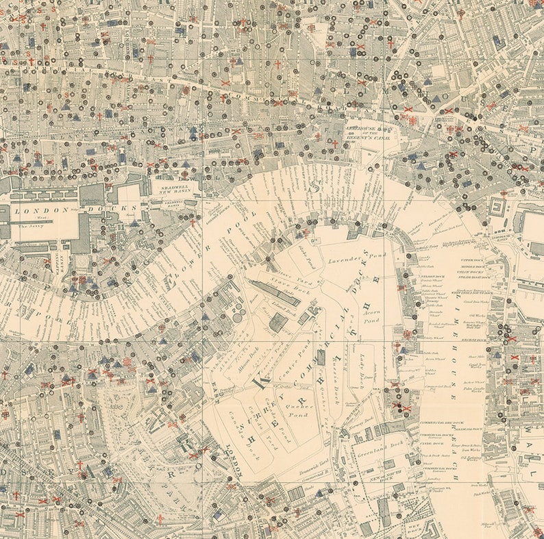 May include: An antique map of London, England, with red and blue markings indicating locations. The map shows the River Thames, the Tower of London, and other landmarks. The map is printed on a cream-colored paper with black text.