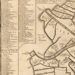 May include: A detailed vintage map of the city of Chiavari, Italy, with a focus on the Sacca di Sta Chiara area. The map features a network of canals, streets, and buildings, with labels in Italian. The map is printed on aged paper with a brown tint.