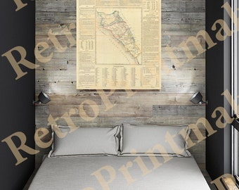 May include: A vintage map of Sinaloa, Mexico, printed on paper and framed in a wooden frame. The map is hanging on a wall in a bedroom with a bed and two pillows.