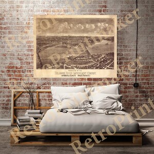May include: An antique map of the Delaware River Improvement Company, showing the area around Morrisville, Pennsylvania and Trenton, New Jersey. The map is printed in sepia tones and features a detailed aerial view of the city.