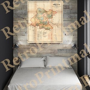 May include: A vintage map of the Republic of Nicaragua, printed on paper with a cream background and brown text. The map is framed and hanging on a wooden wall.