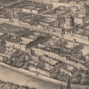 May include: An aerial view of a historic city with a focus on a large, circular building with a dome. The building is surrounded by smaller buildings and trees. The image is in black and white.