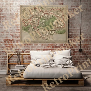 May include: A vintage map of Austria-Hungary, printed on paper with a cream background. The map shows the borders of the Austro-Hungarian Empire, with the names of the provinces and cities labeled in German. The map is framed and hanging on a brick wall.