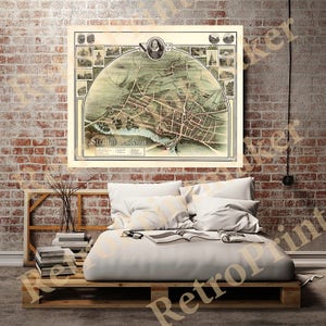 May include: An antique map of Stratford-upon-Avon, England, featuring a portrait of William Shakespeare in the top right corner. The map depicts the town's streets, buildings, and landmarks, including the River Avon.