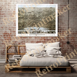 May include: An antique map of Hartford, Connecticut, showing the city's layout and surrounding areas. The map is printed in black and white with some hand-coloring. The map is framed and hanging on a brick wall.