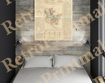 May include: A vintage map of Jalisco, Mexico, printed on paper and framed in a wooden frame. The map is hanging on a wood-paneled wall above a bed with white bedding.