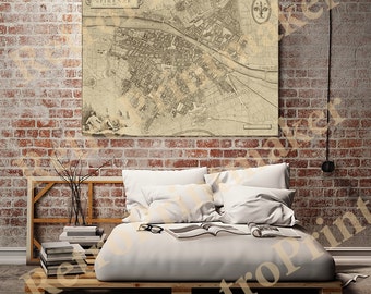 May include: A vintage map of Florence, Italy, printed on canvas and hanging on a brick wall above a bed with white bedding. The map shows the city's streets and landmarks.