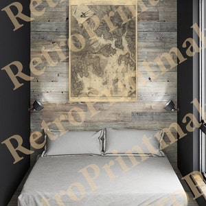 May include: A vintage map of the Battle of Bunker Hill, printed on paper, framed and hanging on a wooden wall in a bedroom with a white bed and two pillows.