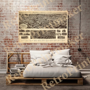 May include: A vintage aerial view map of the city of Jacksonville, Florida. The map shows the city's layout and landmarks, including the St. Johns River. The map is printed on aged paper with a brown tint.