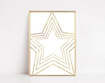 May include: A framed art print featuring a gold star design on a white background. The star is composed of layered gold lines, creating a geometric and modern aesthetic. The frame is a thin, gold color, complementing the artwork.