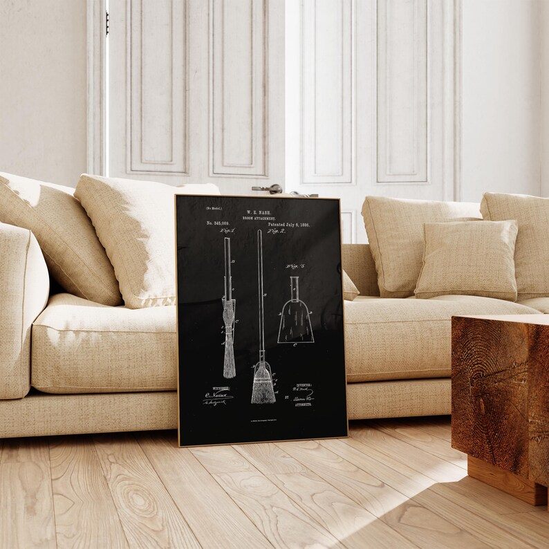 May include: A framed black print showcasing a vintage patent for a broom attachment. The print includes detailed line drawings of the broom, handle, and dustpan, with technical annotations and the name "W.R. Park". The artwork is set against a black background.