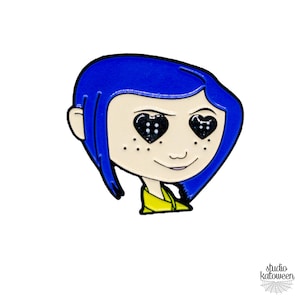 May include: A pin featuring a cartoon character with blue hair and heart-shaped eyes filled with black glitter. The character has freckles and is wearing a yellow shirt. The pin is outlined in black.