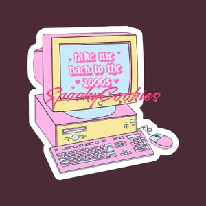 May include: A pink and yellow computer with a monitor that says "take me back to the 2000s" with pink hearts. The computer has a keyboard and a mouse. The text "Spacey Cookies" is written in pink on the monitor.