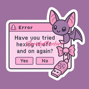 May include: A pink and white computer error message with the text "Have you tried turning it off and on again?" with a pink and purple bat with a pink bow on its tail and a USB drive with a pentagram on it.